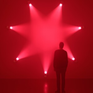 Rose. Ann Veronica Janssens. 7 light projectors, artificial haze, pink filters 2007